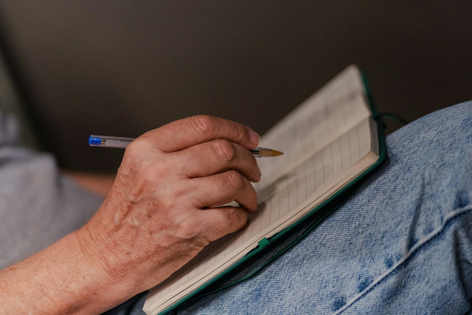 Weekly plan being written in a notebook